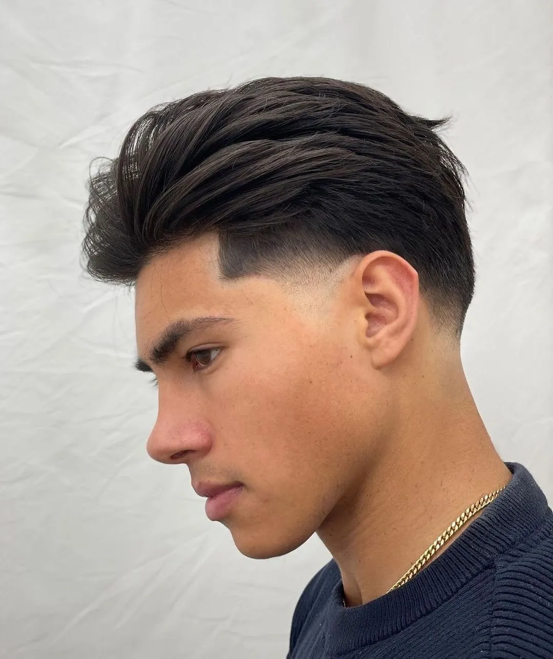 low drop fade slick back, straight thick hair, glossy finish