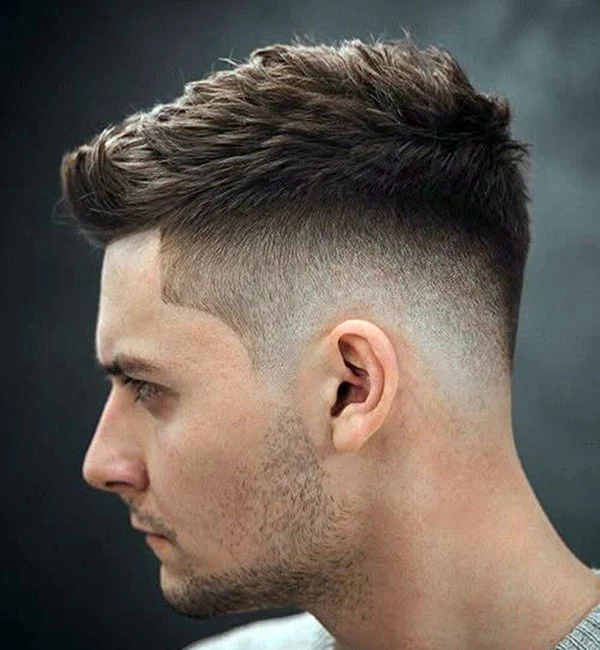 low drop fade quiff on straight hair with textured volume
